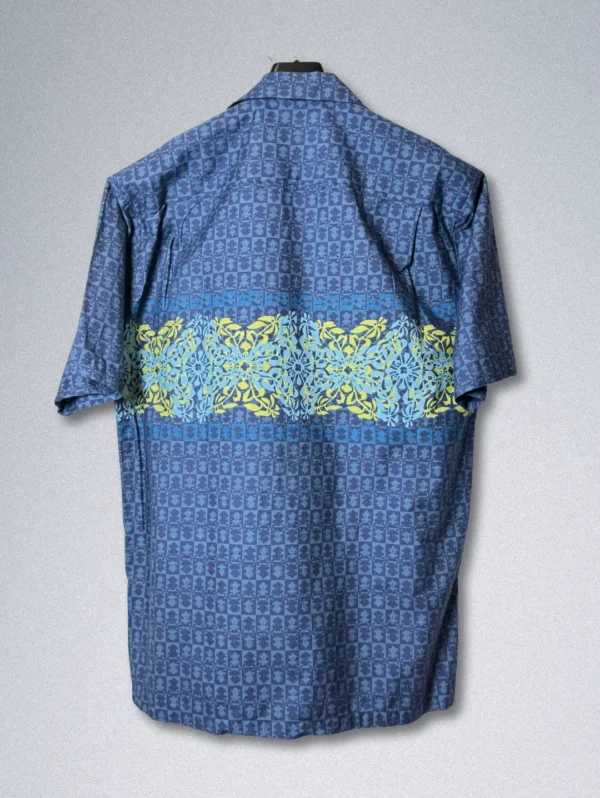 Men's Koa Road Horizon Cotton Shirt, a blue button-down with a horizontal band of yellow and light blue floral patterns across the chest.