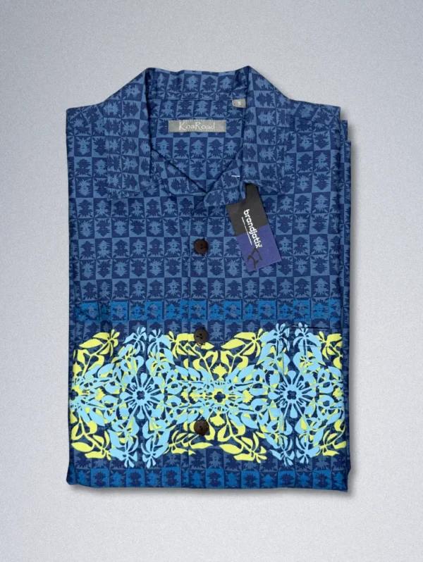 Men's Koa Road Horizon Cotton Shirt, a blue button-down with a horizontal band of yellow and light blue floral patterns across the chest.
