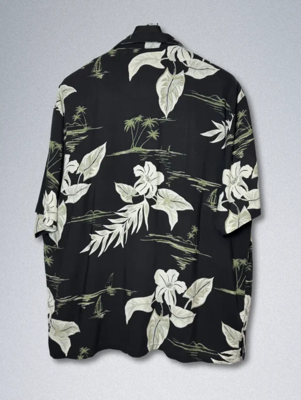 Men's Island Blue Hawaiian Shirt, a black short-sleeve button-down with a high-contrast white tropical print.