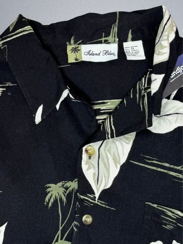Men's Island Blue Hawaiian Shirt, a black short-sleeve button-down with a high-contrast white tropical print.
