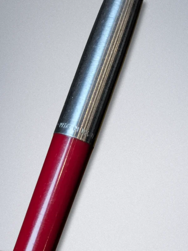 Genuine Parker ballpoint pen with a burgundy barrel, stainless steel cap, and gold arrow clip.