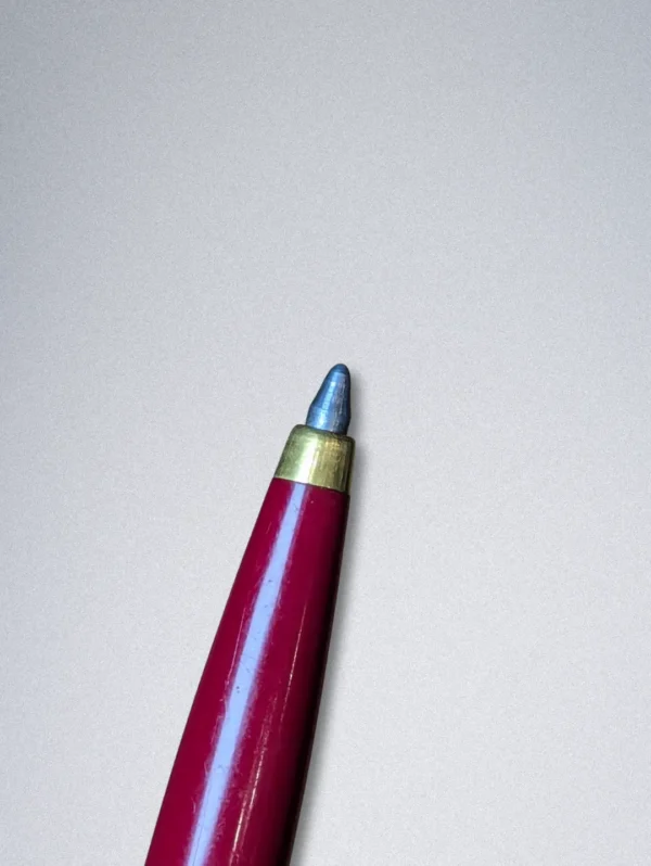 Genuine Parker ballpoint pen with a burgundy barrel, stainless steel cap, and gold arrow clip.